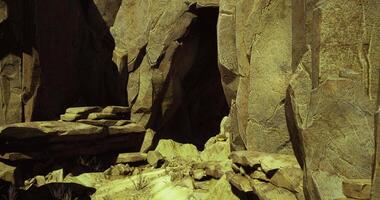 CGI Exploring a rocky cave entrance in a desert landscape during daylight video