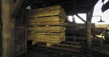 CGI Wooden pallets stacked inside a rustic warehouse near a loading dock video