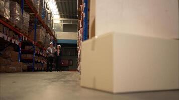 Business woman and warehouse workers are reviewing the list of items based on the documentation,148 photo