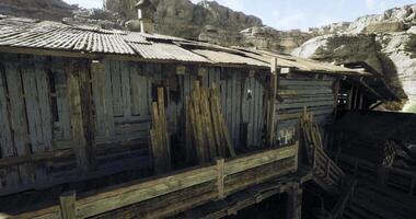 CGI Abandoned wooden structure in rocky landscape under clear sky video