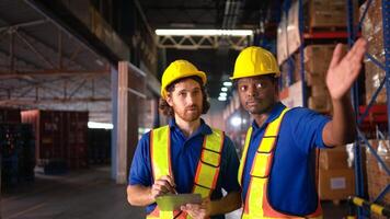A bunch of warehouse workers are reviewing the list of items based on the documentation,124 photo