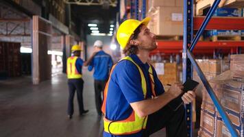 Portrait of warehouse workers are reviewing the list of items based on the documentation,116 photo