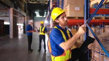 Portrait of warehouse workers are reviewing the list of items based on the documentation,104 photo
