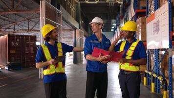 A bunch of warehouse workers are reviewing the list of items based on the documentation,91 photo