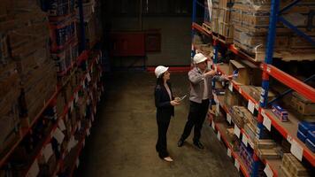 Business woman and warehouse workers are reviewing the list of items based on the documentation,67 photo