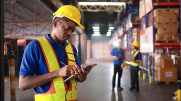 Portrait of warehouse workers are reviewing the list of items based on the documentation,44 photo