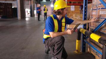 Portrait of warehouse workers are reviewing the list of items based on the documentation,21 photo