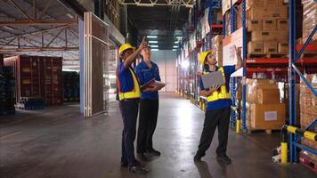 A bunch of warehouse workers are reviewing the list of items based on the documentation,5 photo