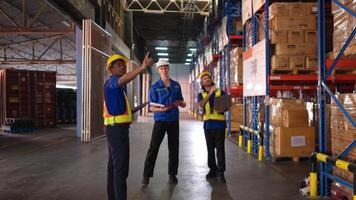 A bunch of warehouse workers are reviewing the list of items based on the documentation,3 photo
