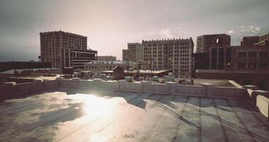 CGI Urban skyline at sunset with buildings and rooftops illuminated video