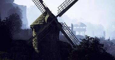 CGI Historic windmill stands tall amidst fog in a tranquil countryside landscape video