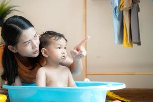 Mom and little child with taking a shower and dressing at home,150 photo