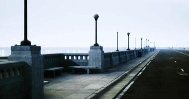 CGI Quiet walkway overlooking a serene waterside at dusk with lampposts video