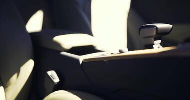 CGI Close view of a modern car interior showcasing the armrest and seat materials video