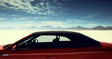 CGI Convertible car parked in a vast desert under a clear blue sky video