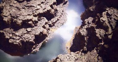 CGI Vibrant canyon river reflecting sunlight in serene natural landscape video
