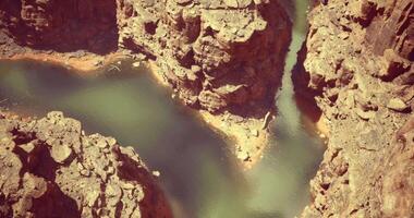 CGI Scenic view of a winding river flowing through dramatic canyon landscape video