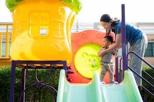 While in vacation at home, a mother engages in activities with little kid in the park,58 photo