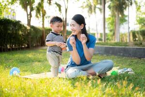 While in vacation at home, a mother engages in activities with little kid in the park,40 photo