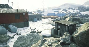 CGI Snowy remote facility surrounded by large rocks and tanks video