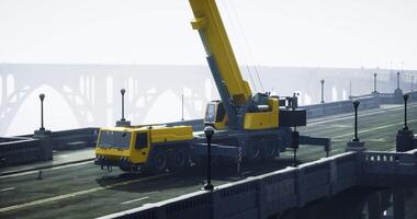 CGI Heavy construction crane operating on foggy bridge at dawn near city video