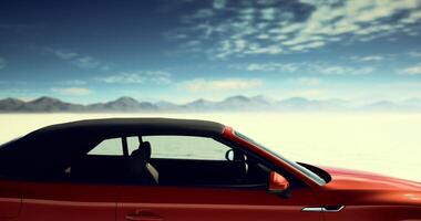 CGI Convertible car parked under a blue sky with mountains in the background video