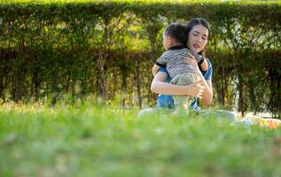 While in vacation at home, a mother engages in activities with little kid in the park,13 photo