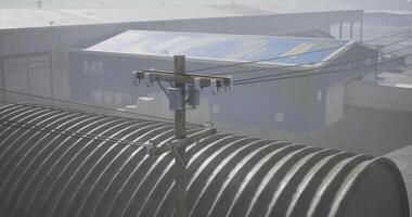 CGI Industrial setting with power lines and metallic structures during daytime video