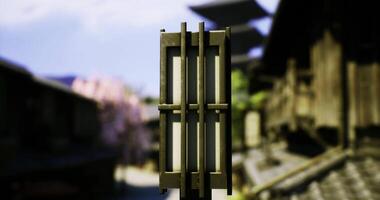 CGI Lantern illuminates traditional architecture in an ancient village setting video