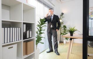 Boss have coffee before meeting to check on progress of business project,297 photo