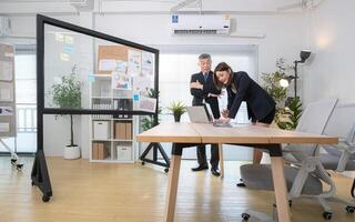 Boss and assistant are on a mission to monitor the progress of a business project,290 photo