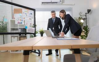 Boss and assistant are on a mission to monitor the progress of a business project,276 photo
