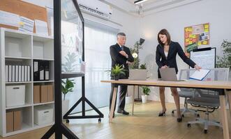 Boss and assistant are on a mission to monitor the progress of a business project,247 photo