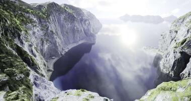 CGI Serene mountain landscape overlooking a tranquil body of water in daylight video