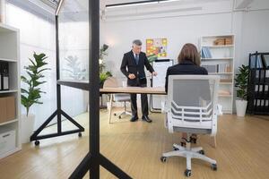 Boss and assistant are on a mission to monitor the progress of a business project,215 photo