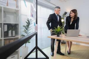 Boss and assistant are on a mission to monitor the progress of a business project,205 photo