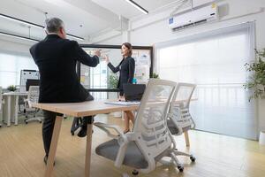 Boss and assistant are on a mission to monitor the progress of a business project,203 photo