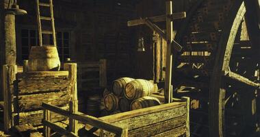 CGI Old watermill interior with wooden barrels and rustic tools in warm light video