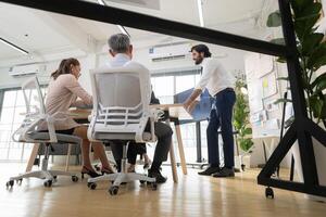 In a contemporary office, a group of senior executives with a mission to approve new projects,156 photo