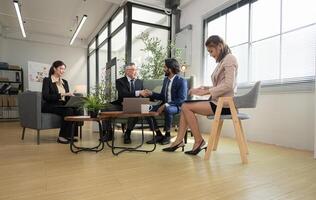 In a contemporary office, a group of senior executives with a mission to approve new projects,140 photo