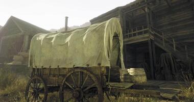 CGI Old wooden wagon with a cloth cover beside a rustic wooden building video
