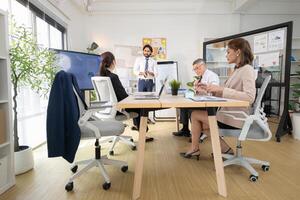 In a contemporary office, a group of senior executives with a mission to approve new projects,113 photo