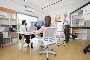 In a contemporary office, a group of senior executives with a mission to approve new projects,112 photo