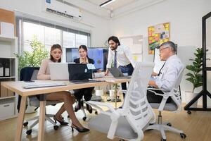 In a contemporary office, a group of senior executives with a mission to approve new projects,104 photo