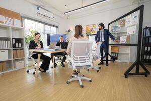 In a contemporary office, a group of senior executives with a mission to approve new projects,105 photo