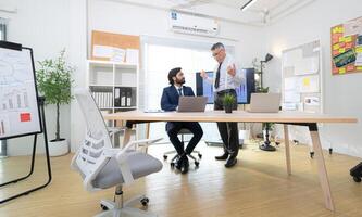In a contemporary office, two senior executives with a mission to brainstorm and monitor,96 photo