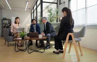 In a contemporary office, a group of senior executives with a mission to approve new projects,84 photo