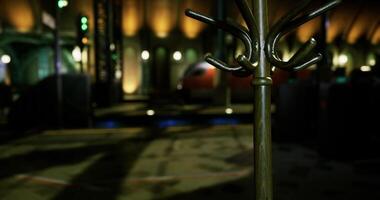 CGI Elegant coat rack stands in a dimly lit venue with warm lighting effects video