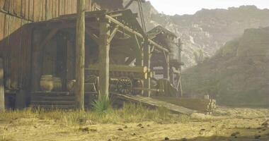 CGI Old wooden structures alongside a dusty road in a rugged landscape video