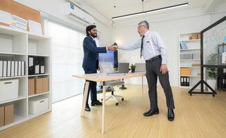 In a contemporary office, two senior executives with a mission to brainstorm and monitor,81 photo